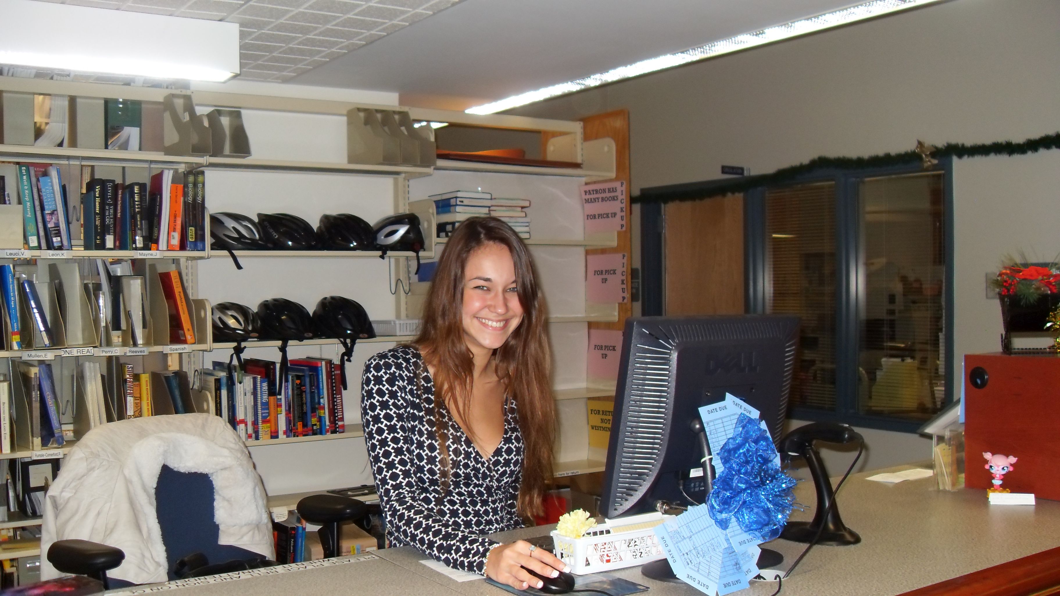 Student working at circulation desk